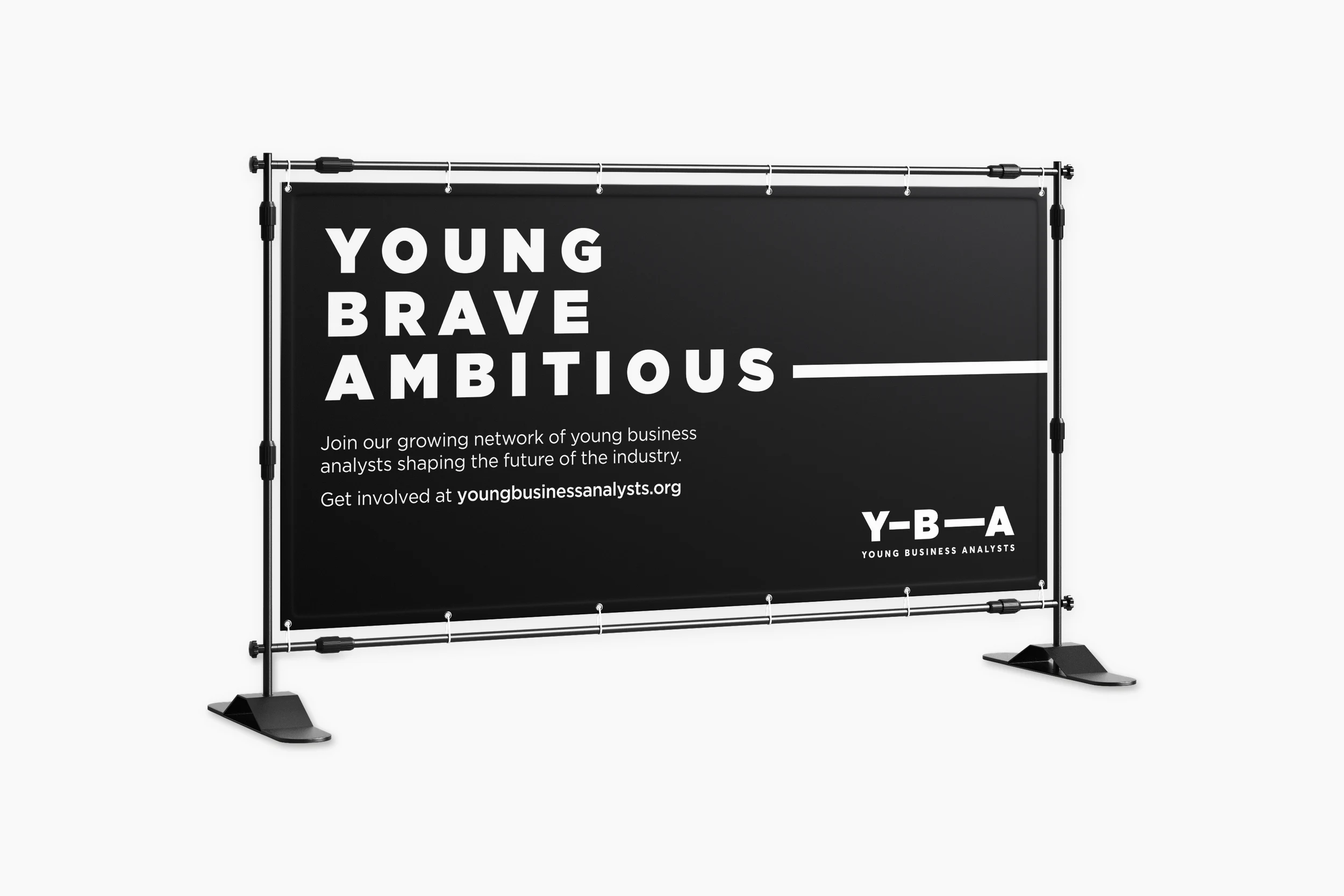 YBA conference banner on a frame stand, in black with ‘Young, brave, ambitious’, the extending line and the YBA logo